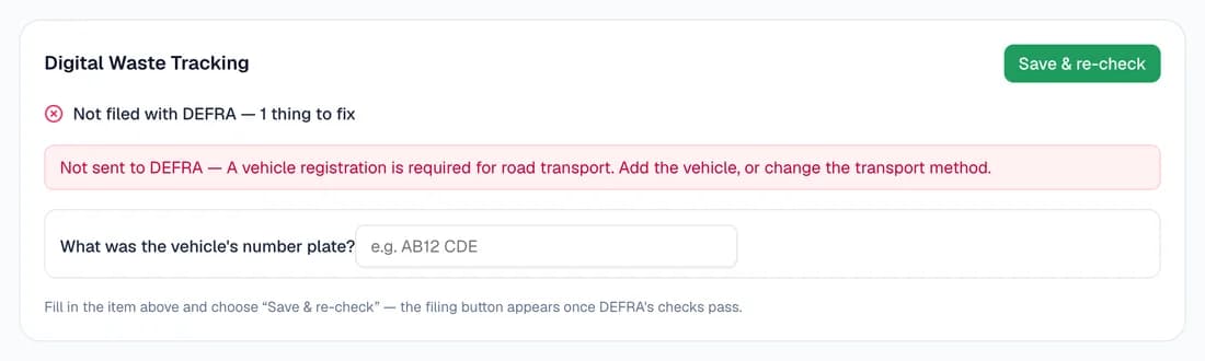 The Digital Waste Tracking card on a note that wasn't filed: “Not filed with DEFRA — 1 thing to fix”, the reason that a vehicle registration is required for road transport, a box asking “What was the vehicle's number plate?”, and a Save & re-check button.
