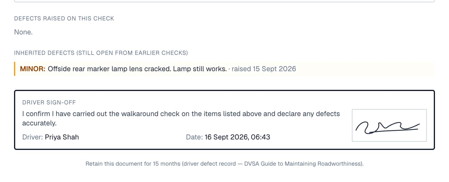 The end of the same printed record: no defects raised on this check, a minor cracked marker lamp lens still open from the previous day's check, and the driver's signed declaration with the date, above a reminder to keep the record for 15 months.