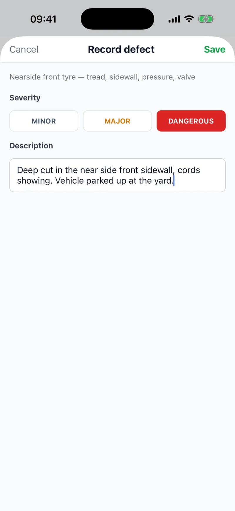 The Record defect sheet in the app for the nearside front tyre: severity set to DANGEROUS rather than minor or major, and the description “Deep cut in the near side front sidewall, cords showing. Vehicle parked up at the yard.”