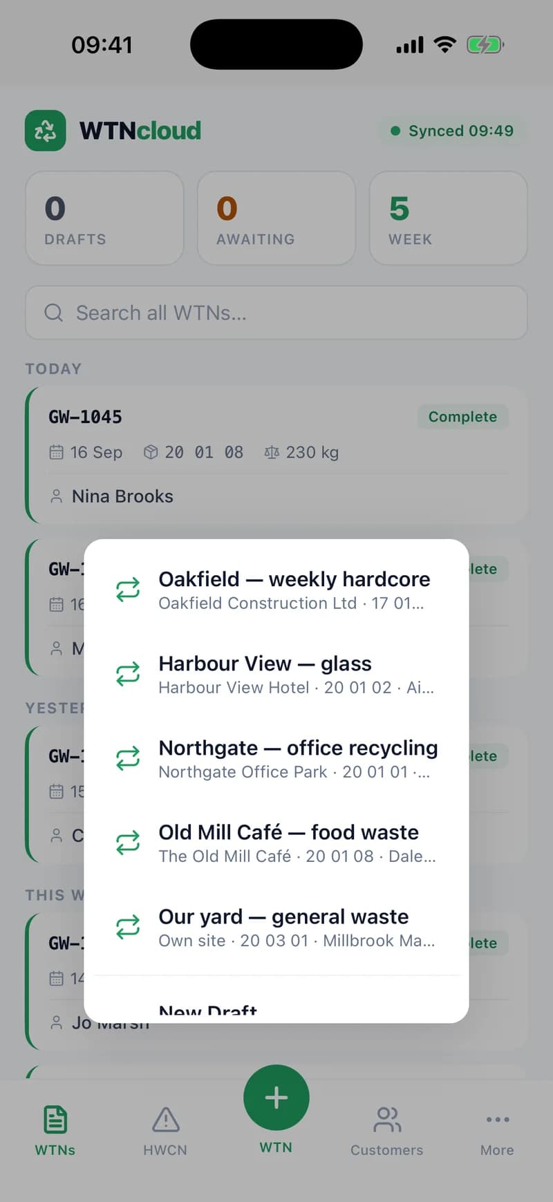 The WTNcloud phone app after a press and hold on the New button: a menu listing five waste profiles — Oakfield weekly hardcore, Harbour View glass, Northgate office recycling, Old Mill Café food waste and Our yard general waste — each with its customer and EWC code, above New Draft.